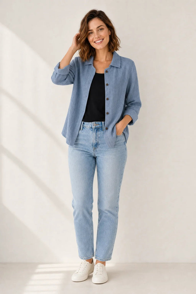 Sofaine Addison collared layering blouse in denim blue, worn open over a black top, full look