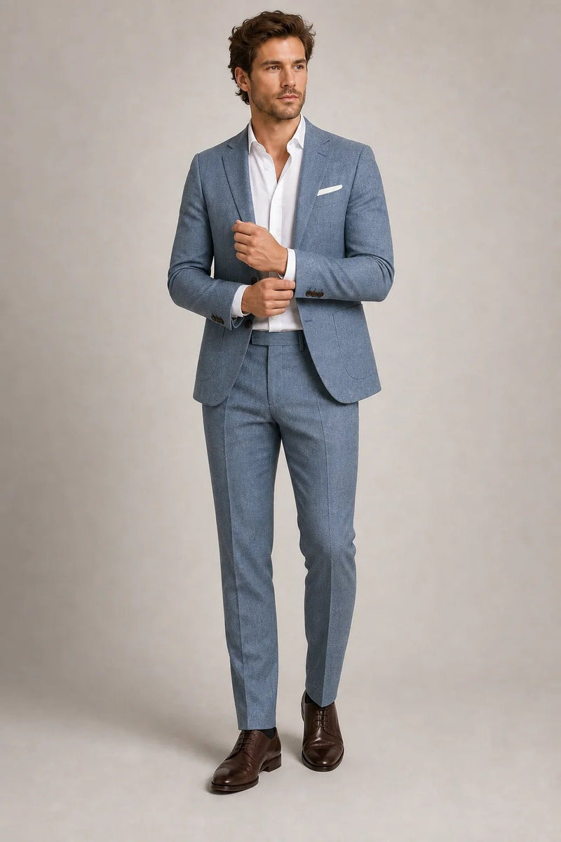 Sofaine Aiden slim-fit blazer and trouser set in light blue, model adjusting cuff, front view