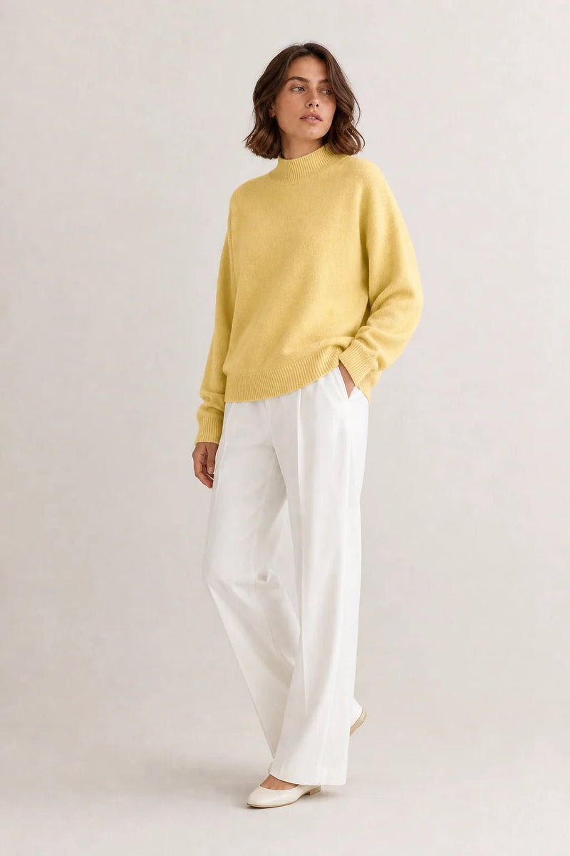 Sofaine Aubrey oversized mock-neck knit sweater in Yellow, worn front