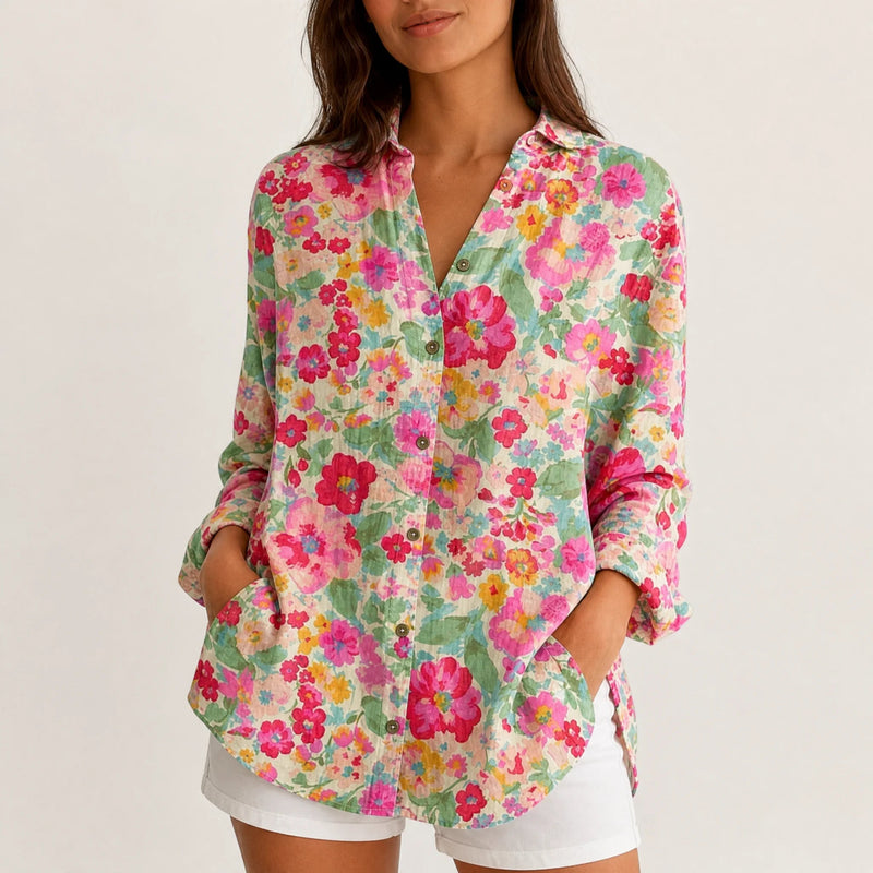 Sofaine Bella button-up blouse in cream with dense pink and green floral print, worn front view