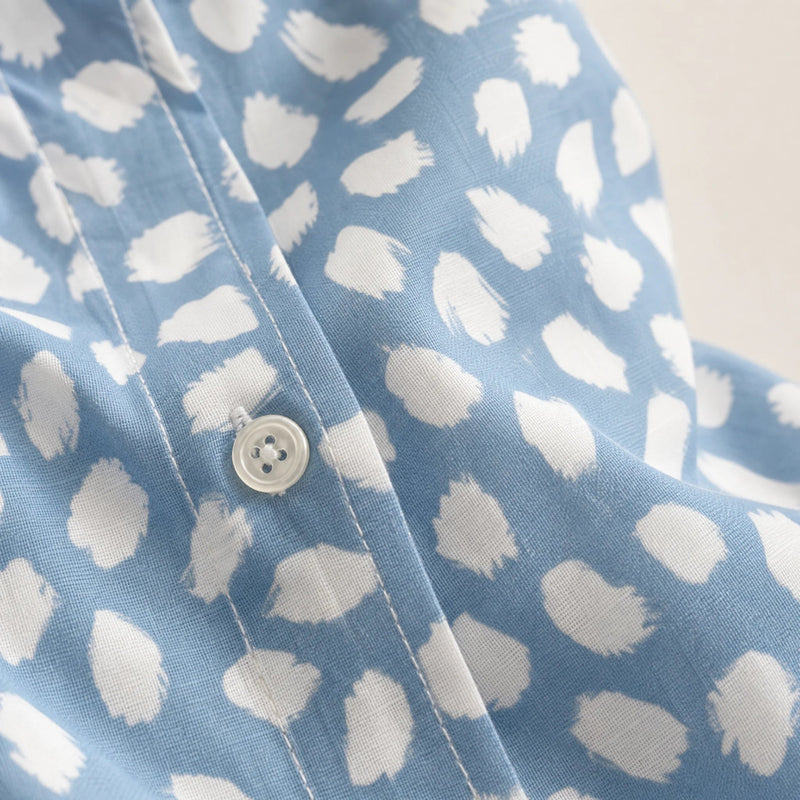 Sofaine Bella light blue blouse, fabric close-up of white brushstroke dot print and button