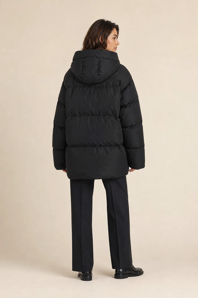 Tara | Oversized Puffer Jacket in Black, studio back view