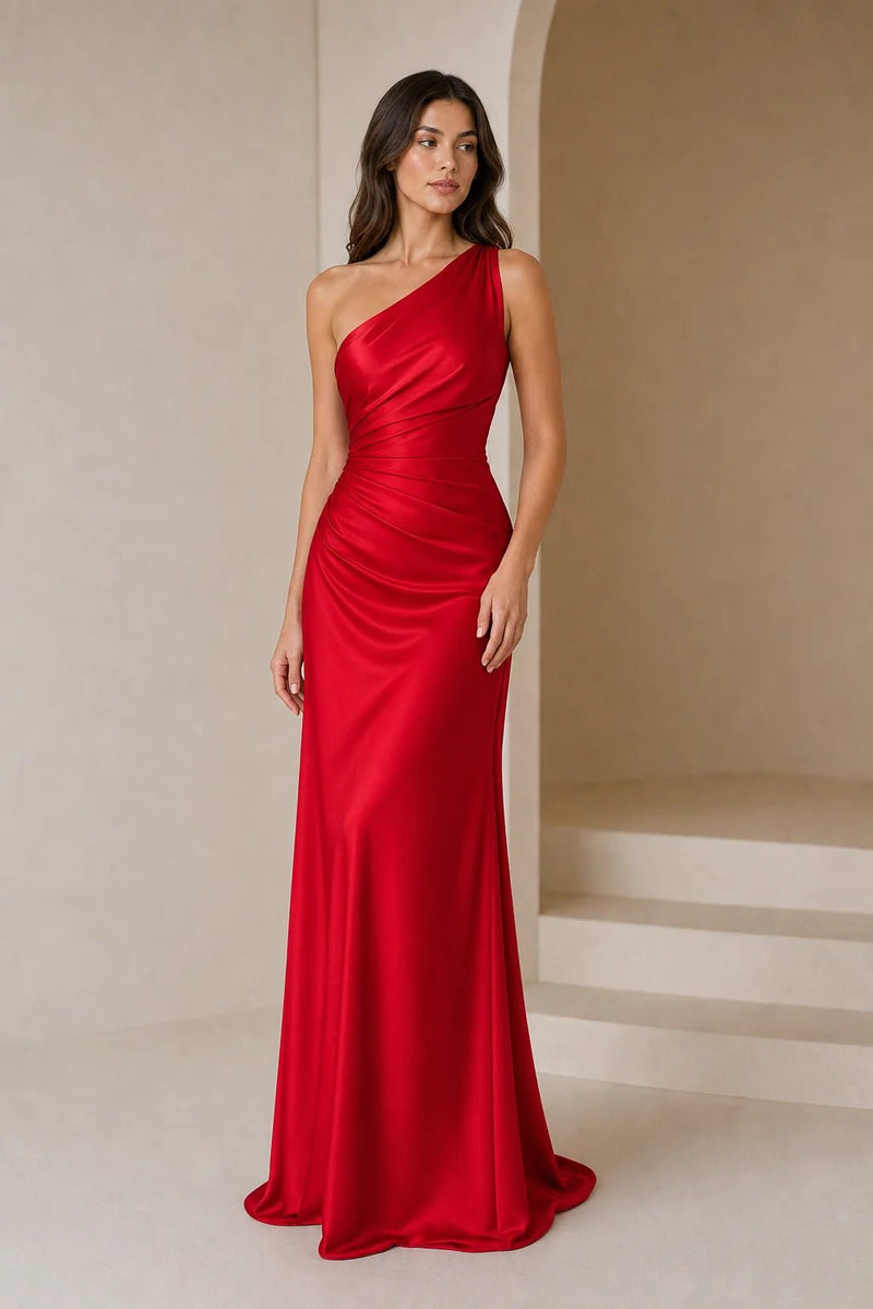 Sofaine Bridget one-shoulder ruched satin gown in red, full-length look beside arched doorway