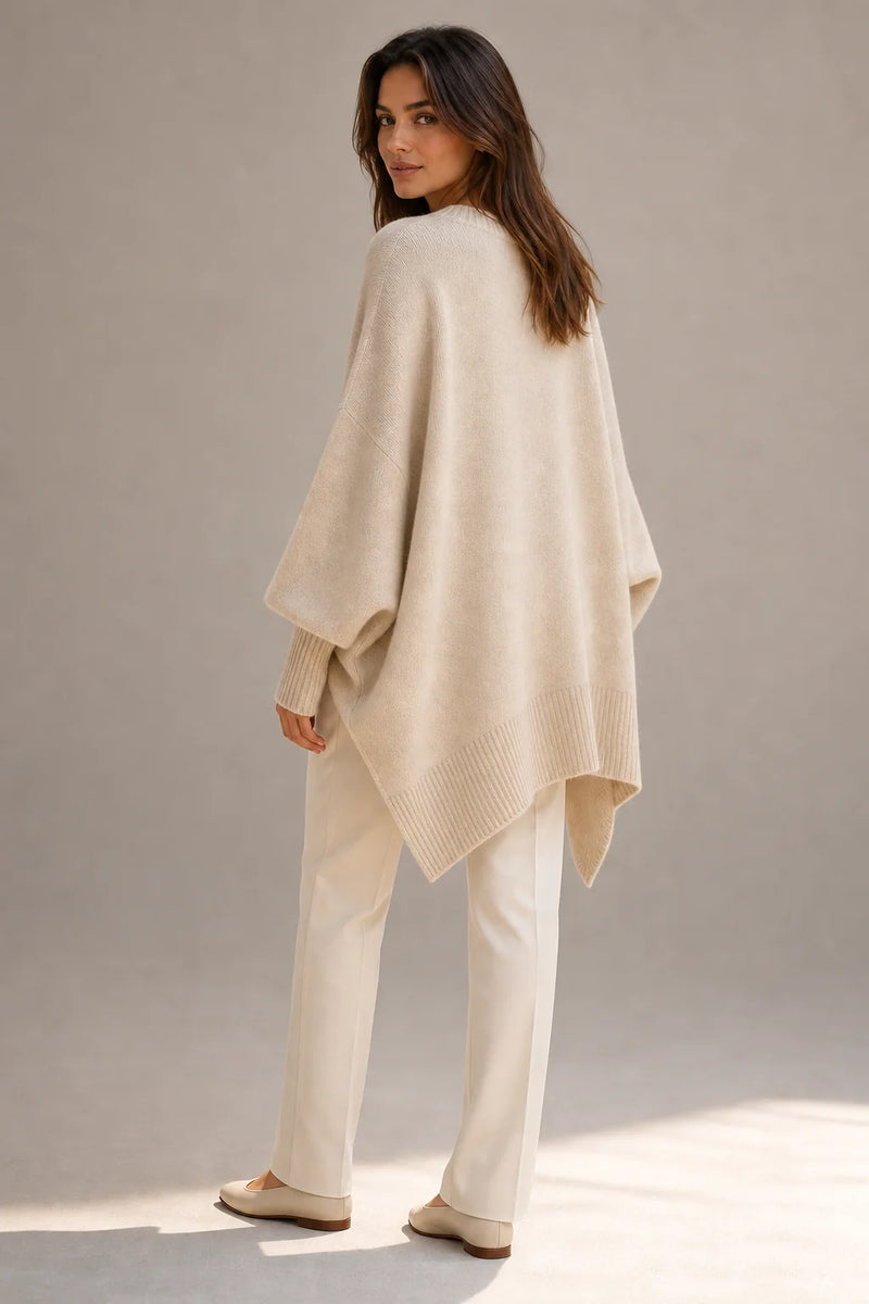 Sofaine Caroline women's oversized asymmetric poncho knit sweater in Beige, worn back view
