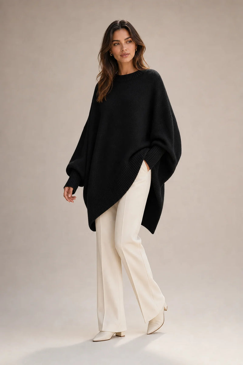 Sofaine Caroline women's oversized asymmetric poncho knit sweater in Black, worn front
