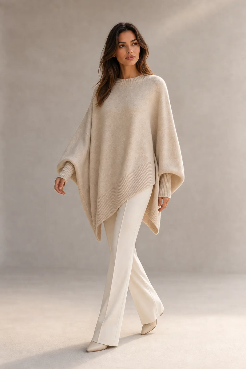 Sofaine Caroline women's oversized asymmetric poncho knit sweater in Beige, styled full-length look
