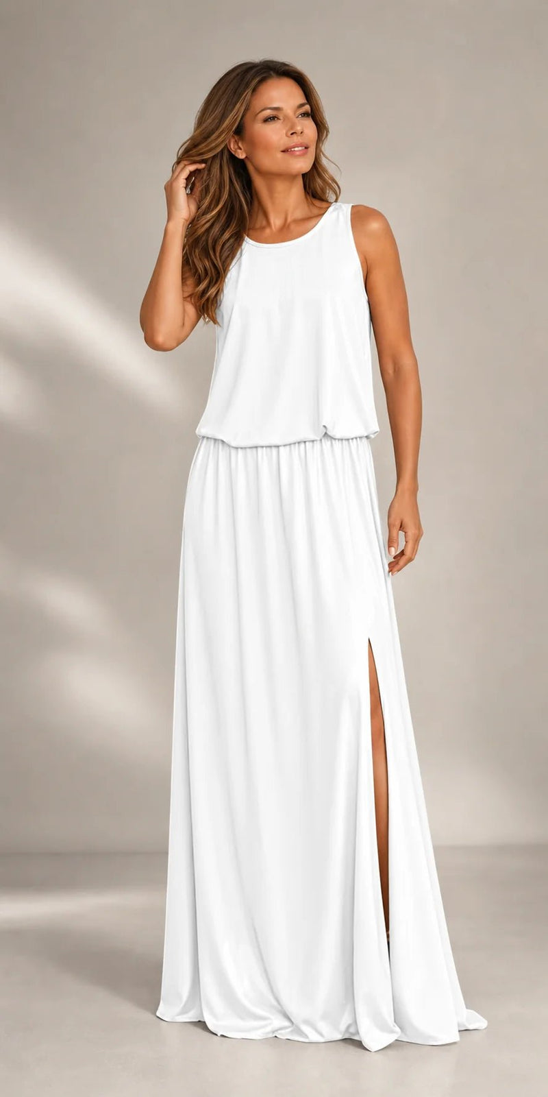 Sofaine Colette sleeveless round-neck maxi dress in white with side slit, worn front view