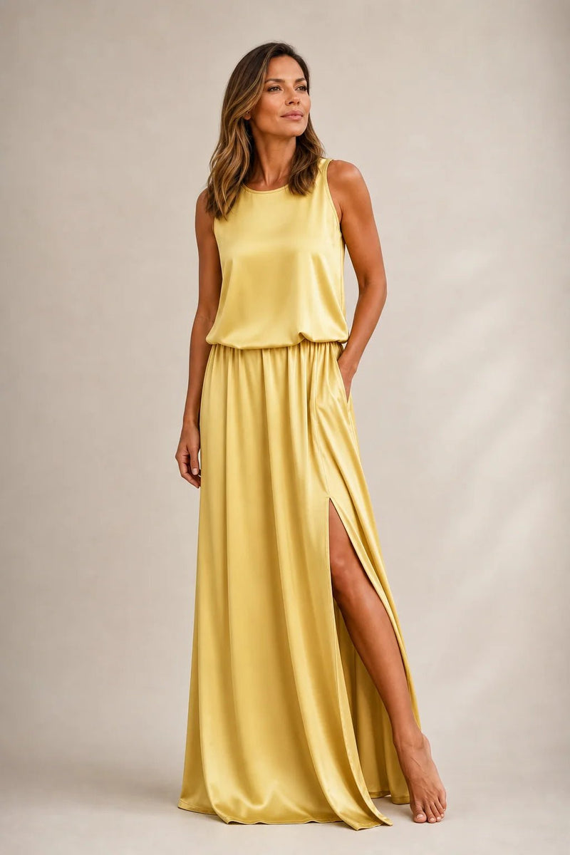 Sofaine Colette pale yellow sleeveless maxi dress, hand in pocket showing leg slit, front view