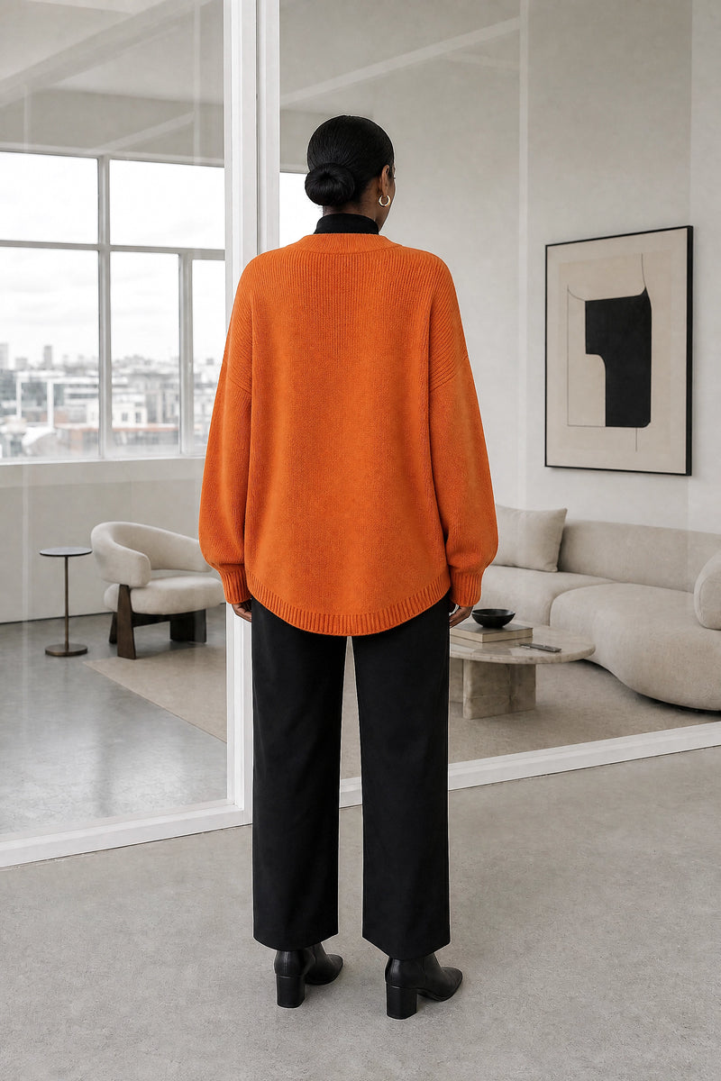 Dawn | V-Neck Sweater in Orange, studio back view