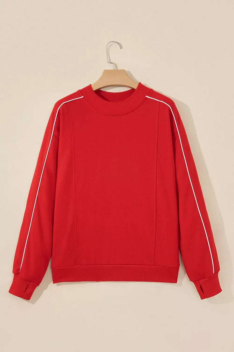 Mock Neck Sweatshirt for Women with Contrast Piping and Thumbholes in Red, front view on hanger