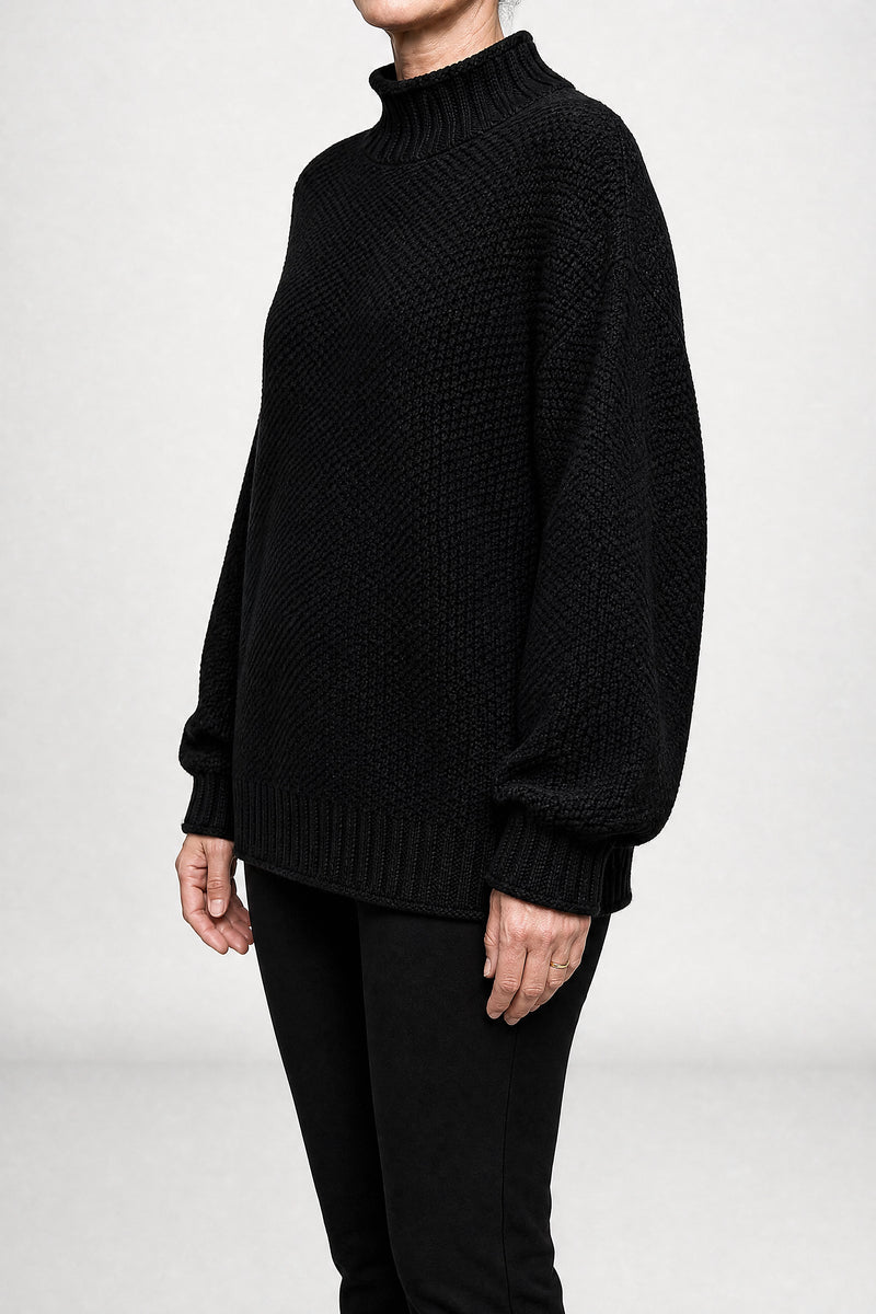Sofaine Elise waffle-knit mock neck oversized sweater in Black, side view studio shot
