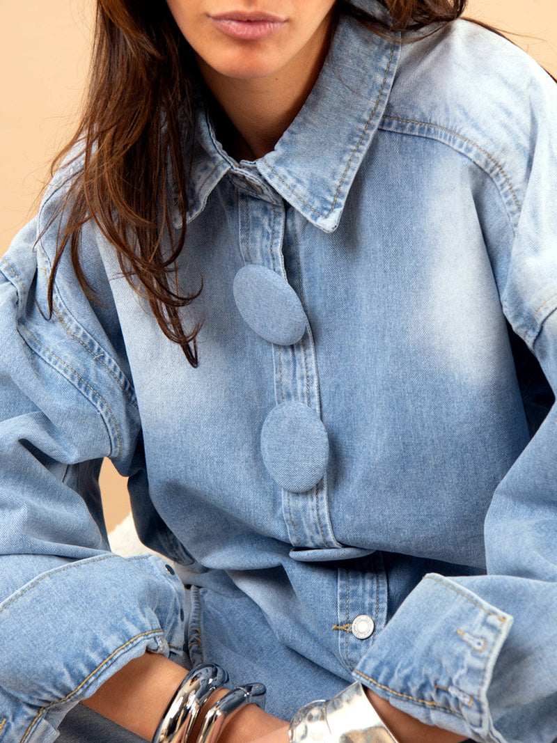 Oversized Denim Shirt Jacket for Women with Statement Buttons in Light Blue, close-up
