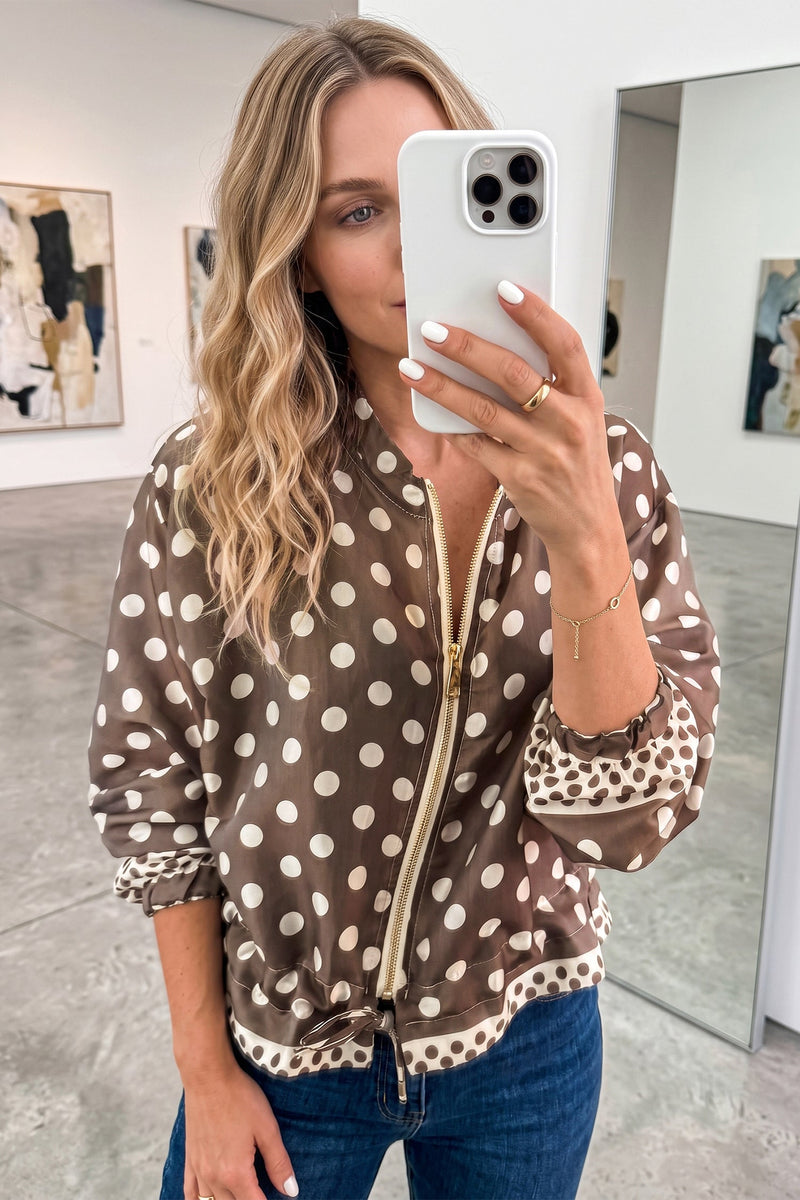 Polka Dot Zip Up Jacket for Women with Drawstring Hem and Contrast Cuffs in Brown, styled front view