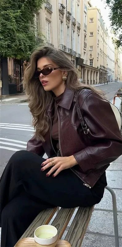 Faux Leather Bomber Jacket for Women with Shirt Collar and Elastic Hem in Burgundy, styled seated view