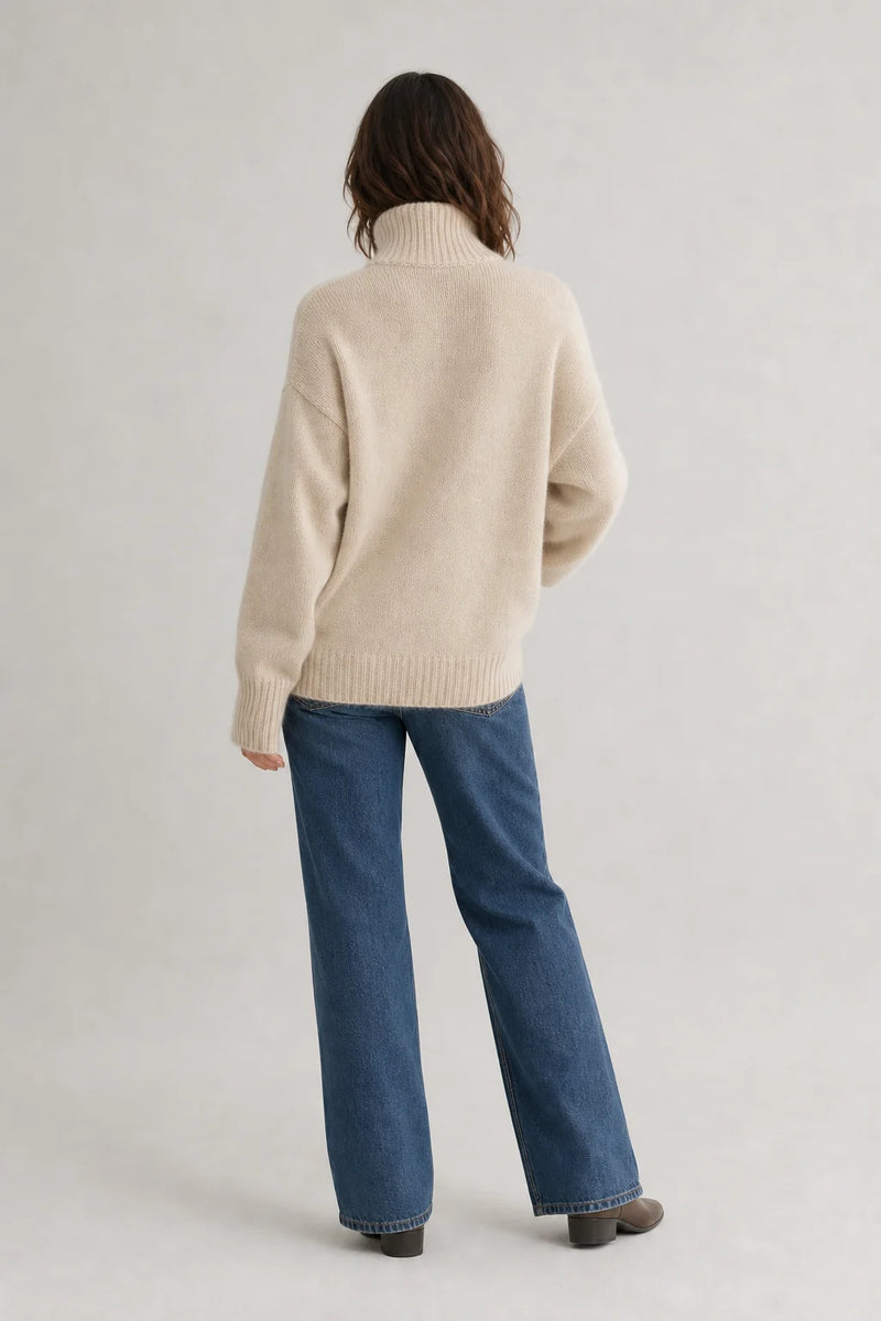 Sofaine Nora women's oversized cashmere turtleneck sweater in Beige, worn back view
