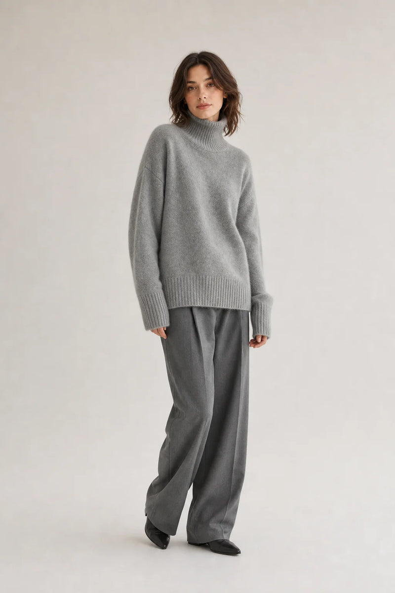 Sofaine Nora women's oversized cashmere turtleneck sweater in Gray, worn front