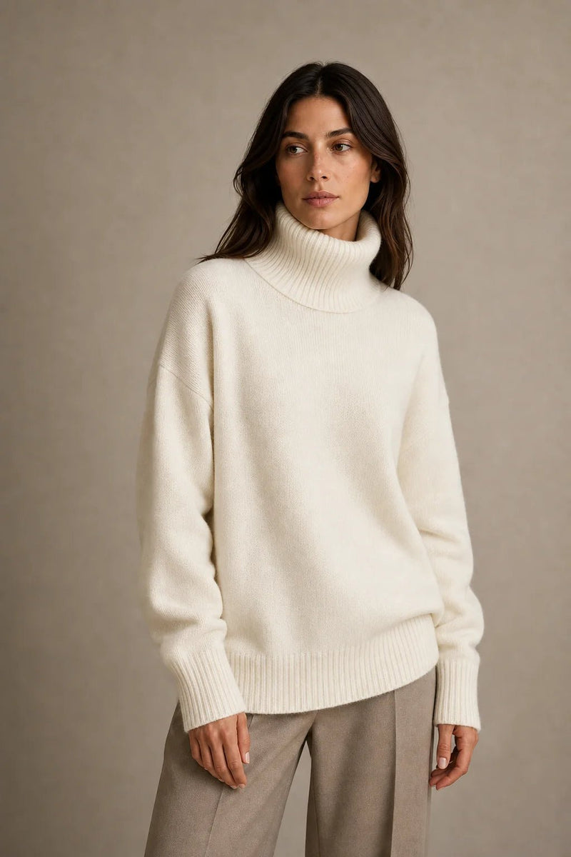 Sofaine Nova oversized knit turtleneck sweater in ivory, worn front view