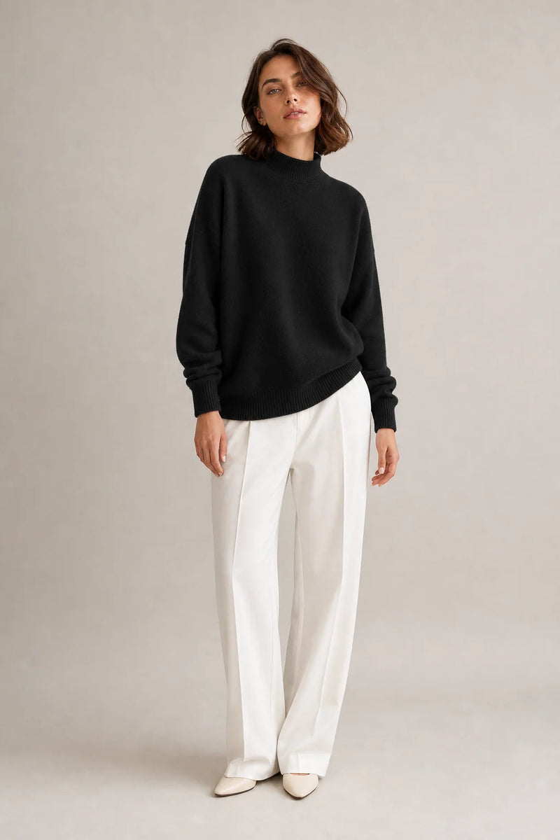 Sofaine Aubrey oversized mock-neck knit sweater in Black, worn front