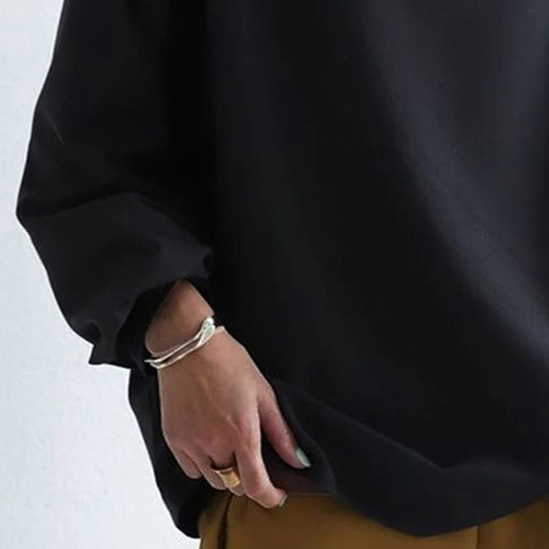 Relaxed Mock Neck Top for Women with Dropped Shoulders and Wide Cuffs in Black, cuff and hem detail
