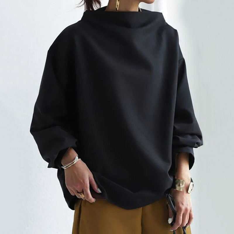 Relaxed Mock Neck Top for Women with Dropped Shoulders and Wide Cuffs in Black, three-quarter view