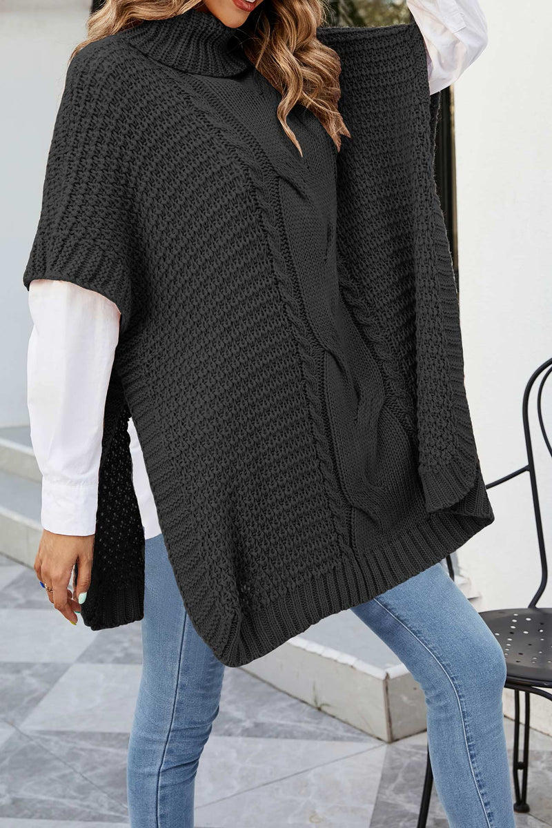 Turtleneck Poncho Sweater for Women with Cable Knit and Side Slits in Black, front view