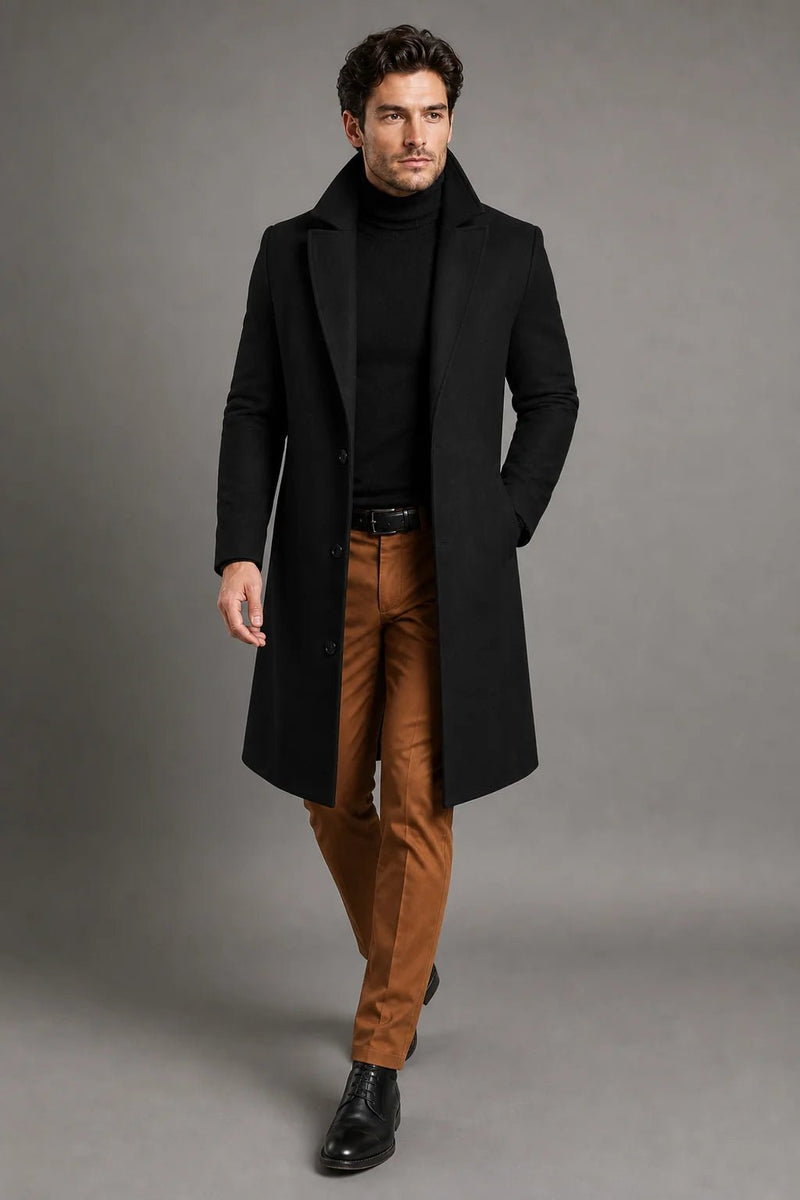 Sofaine Santiago wool overcoat in black styled with tan pants, worn front view mid-step