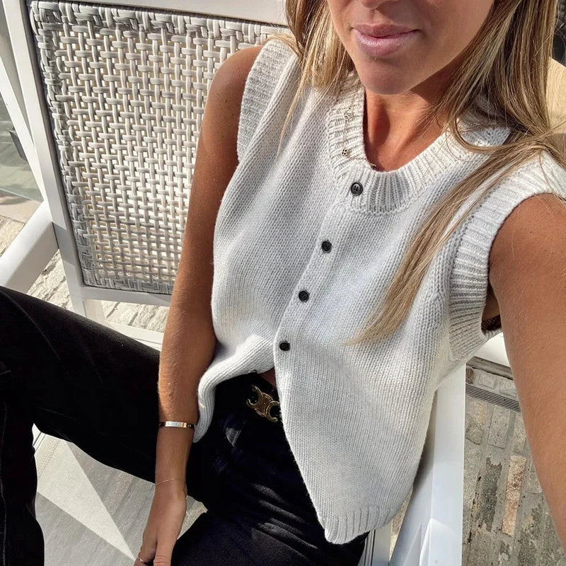 Knit Button Up Sweater Vest for Women with Crew Neck and Ribbed Trim in White, seated styled view