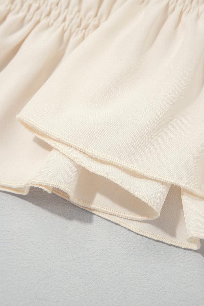 Smocked Peplum Blouse for Women with Ruffle Neck and Balloon Sleeves in Cream, hem detail