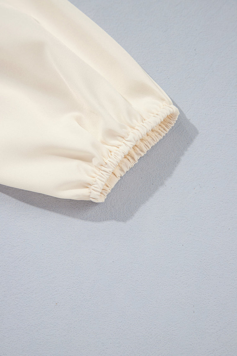 Smocked Peplum Blouse for Women with Ruffle Neck and Balloon Sleeves in Cream, sleeve cuff detail