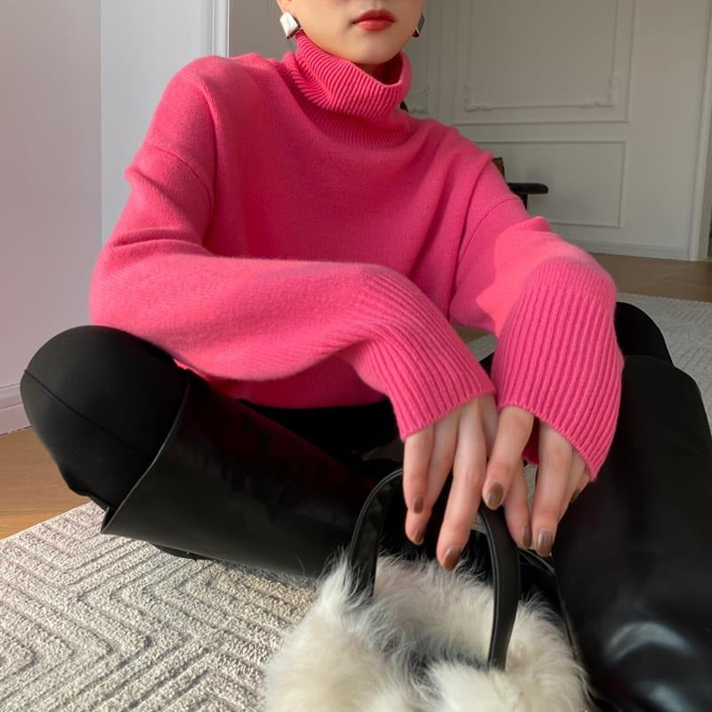 Oversized Knit Turtleneck Sweater for Women with Dropped Shoulders in Pink, seated view