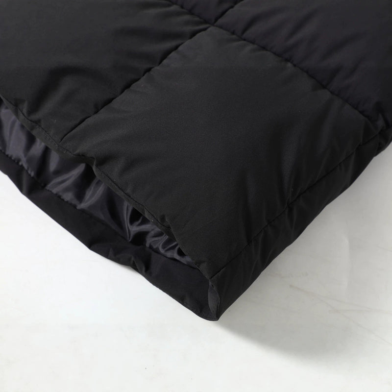 Long Quilted Parka Coat for Women with Faux Fur Hood and Drawstring Waist in Black, hem close-up
