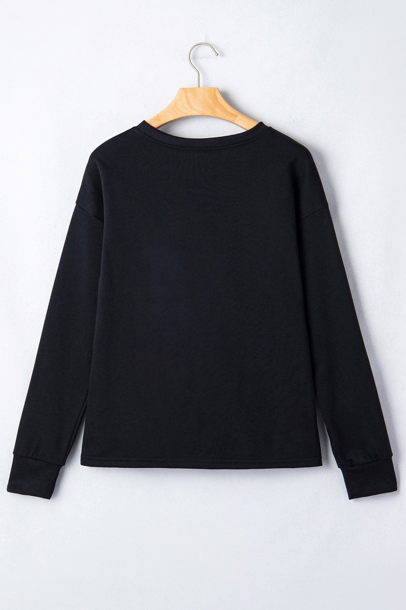 Rhinestone Pumpkin Long Sleeve Top for Women with Checkered Design in Black, back view on hanger