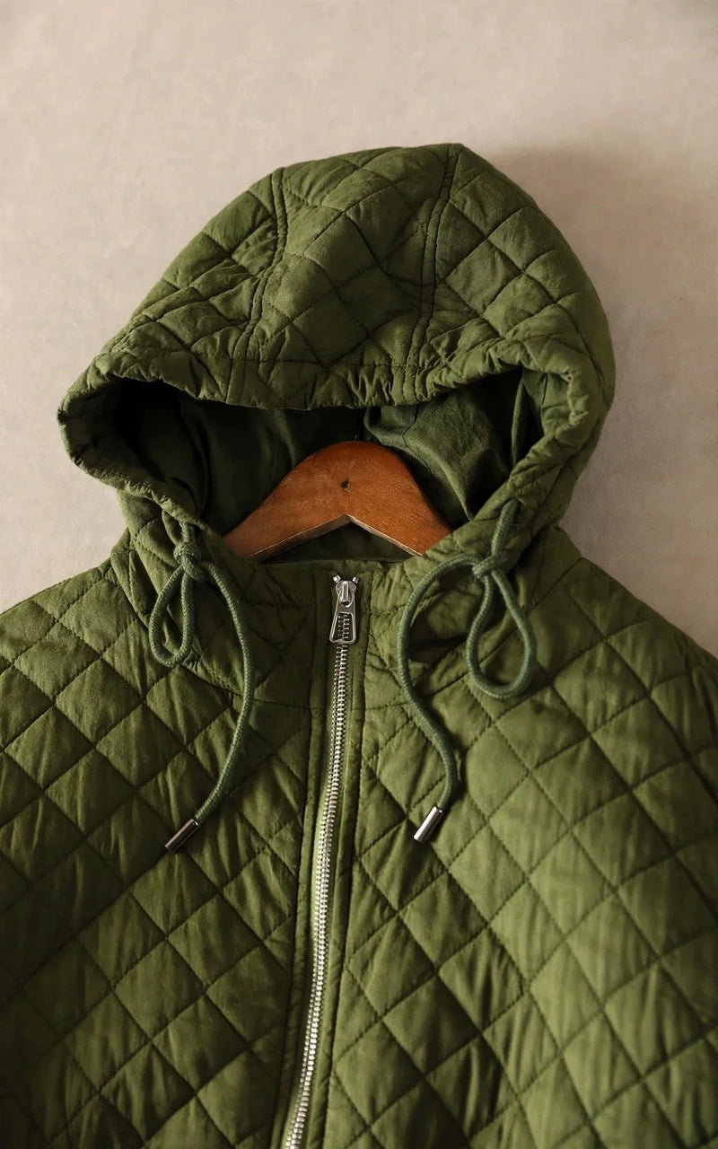 Lightweight Quilted Jacket for Women with Hood and Relaxed Fit, studio side view