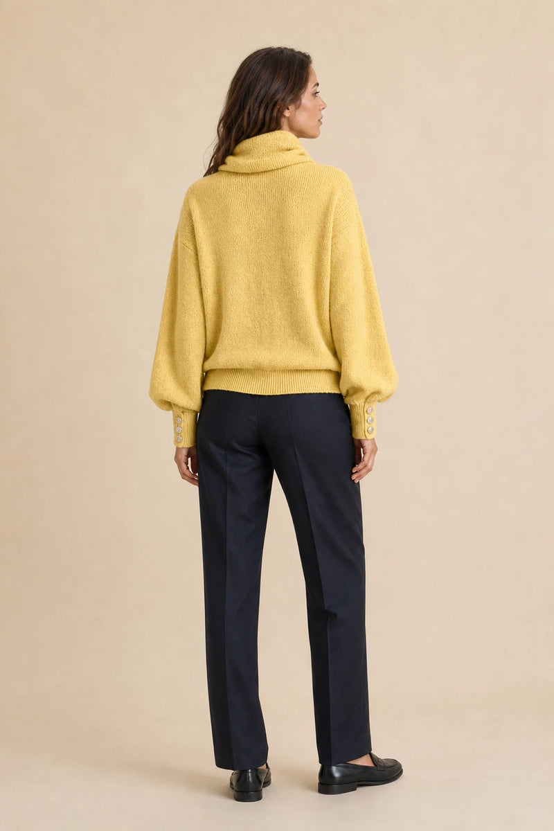 Ivory | Button-Cuff Turtleneck Sweater in Yellow, studio back view